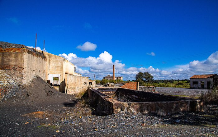 Ruined building complex with polluted soil and blue sky - Crédit: Cavan/AdobeStock